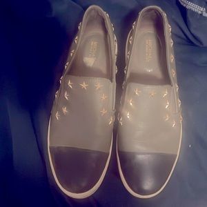 Michael Kors slip on tennis shoes army green and black. Need to be cleaned